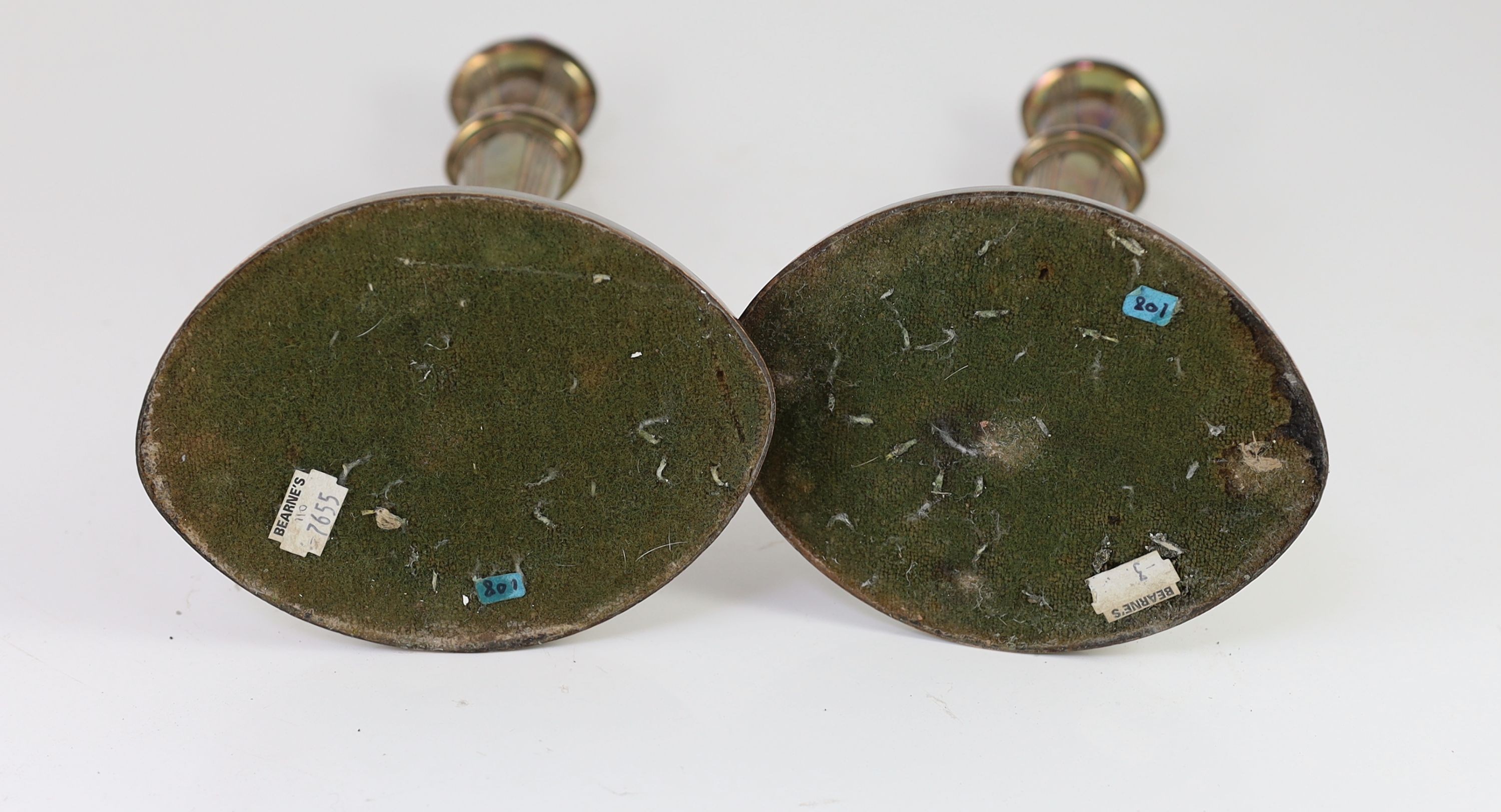 A pair of Sheffield plate candlesticks and nozzles, 32cm high